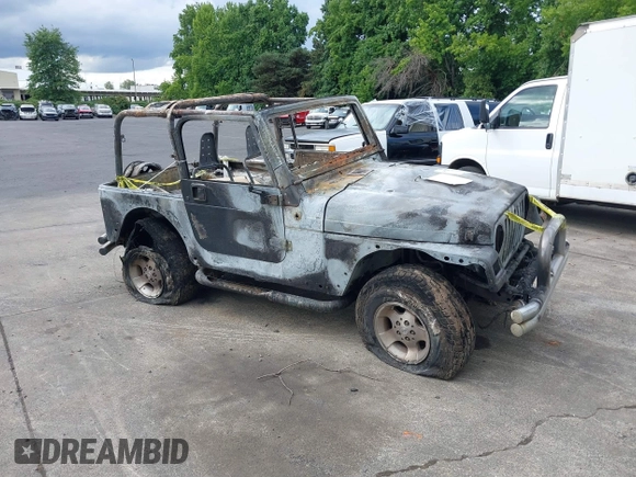 2000 Jeep Wrangler Sport with VIN 1J4FA49S5YP797345, listed as a IAAI auction lot 40322775 with Not Provided miles and . Bid and sale history available at DreamBid. Image 1.