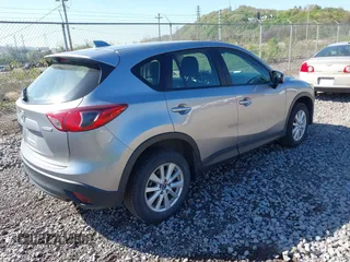 2013 Mazda CX-5 Sport with VIN JM3KE4BE0D0125748, listed as a IAAI auction lot 42143020 with 158,580 mi miles. Bid and sale history available at carsss.com. Image 4.
