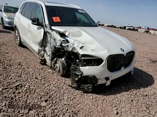 2023 BMW X5 xDrive45e z VIN 5UXTA6C02P9N98430, wystawiony jako Copart lot #51509085 z przebiegiem 24 093 mil mil oraz Szkoda całkowita • Salvage title. Historia ofert i sprzedaży dostępna na DreamBid. Obrazek 12.