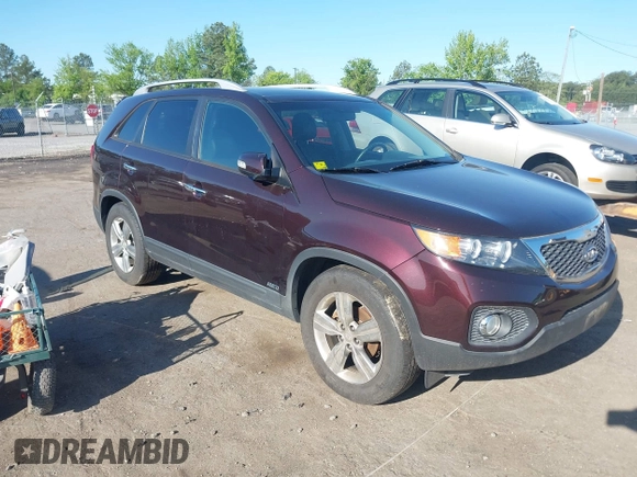 2012 Kia Sorento EX with VIN 5XYKUDA23CG206609, listed as a IAAI auction lot 42142072 with 162,574 mi miles. Bid and sale history available at carsss.com. Image 1.
