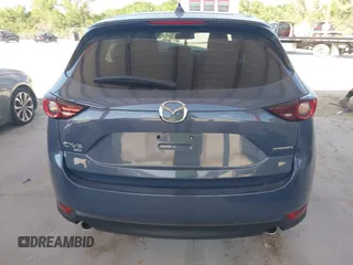 2021 Mazda CX-5 Touring with VIN JM3KFBCM3M0406787, listed as a IAAI auction lot 41800564 with 42,254 mi miles and . Bid and sale history available at carsss.com. Image 17.