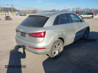 2017 Audi Q3 Premium Plus z VIN WA1JCCFS5HR011907, wystawiony jako IAAI lot #41675496 z przebiegiem 102 591 mil mil oraz . Historia ofert i sprzedaży dostępna na DreamBid. Obrazek 4.