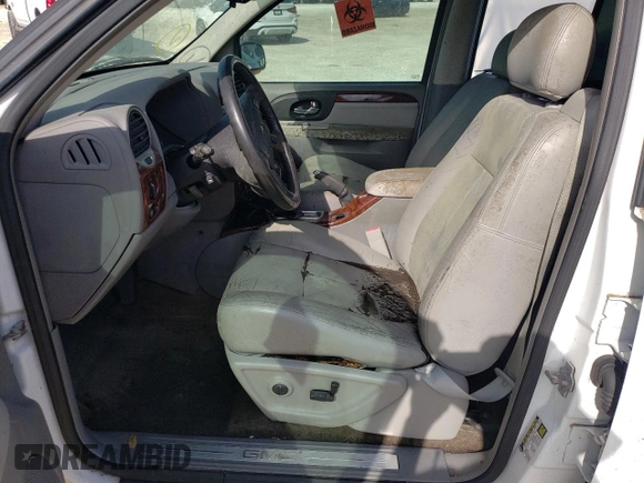 2005 GMC Envoy SLT with VIN 1GKDT13S052311455, listed as a Copart auction lot 73635434 with Not Provided miles and Salvage Title. Bid and sale history available at DreamBid. Image 7.