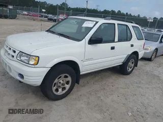 2000 Isuzu Rodeo S z VIN 4S2CK58W0Y4342098, wystawiony jako IAAI lot #42305343 z przebiegiem 150 367 mil mil oraz . Historia ofert i sprzedaży dostępna na DreamBid. Obrazek 2.