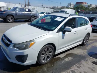 2013 Subaru Impreza Wagon 2.0i Sport Premium with VIN JF1GPAL68DH808139, listed as a IAAI auction lot 41992551 with 222,945 mi miles. Bid and sale history available at carsss.com. Image 2.