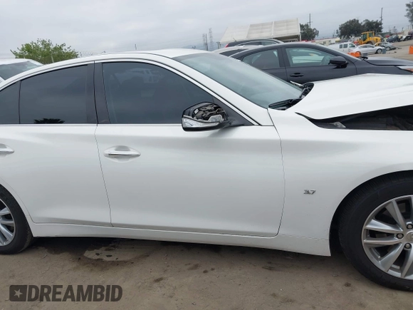 2015 Infiniti Q50 Premium z VIN JN1BV7AP2FM344044, wystawiony jako IAAI lot #42217012 z przebiegiem 155 714 mil mil oraz . Historia ofert i sprzedaży dostępna na DreamBid. Obrazek 13.