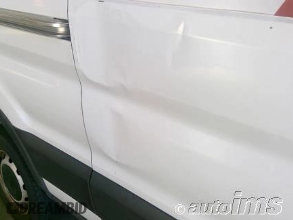 2021 Ford Transit Cargo z VIN 1FTBR1C8XMKA20224, wystawiony jako IAAI lot #42789308 z przebiegiem 76 845 mil mil oraz . Historia ofert i sprzedaży dostępna na DreamBid. Obrazek 14.