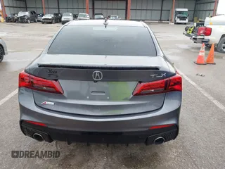 2019 Acura TLX w/A-Spec Pkg z VIN 19UUB2F61KA000932, wystawiony jako IAAI lot #42164064 z przebiegiem 79 080 mil mil oraz . Historia ofert i sprzedaży dostępna na DreamBid. Obrazek 16.