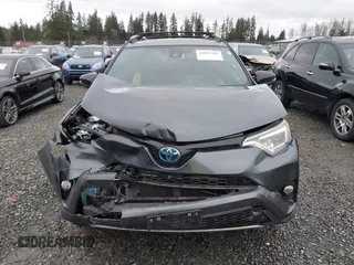 2018 Toyota RAV4 Hybrid SE with VIN JTMJJREV7JD208249, listed as a IAAI auction lot 41859301 with 91,899 mi miles and . Bid and sale history available at DreamBid. Image 12.