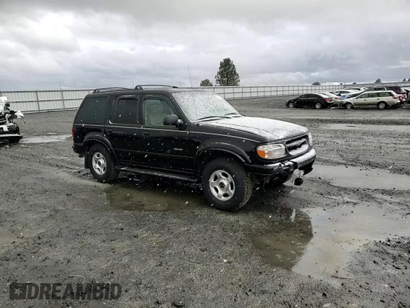 2000 Ford Explorer Limited with VIN 1FMDU75EXYZA76329, listed as a Copart auction lot 80952474 with 90,637 mi miles and Salvage title. Bid and sale history available at DreamBid. Image 12.