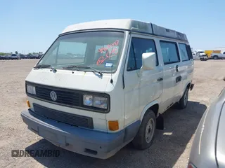 1991 Volkswagen Vanagon GL with VIN WV2ZB0258MG006802, listed as a IAAI auction lot 41969597 with 241,953 mi miles and . Bid and sale history available at DreamBid. Image 2.