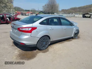 2012 Ford Focus SE with VIN 1FAHP3F2XCL217086, listed as a IAAI auction lot 42072717 with 112,549 mi miles. Bid and sale history available at carsss.com. Image 4.