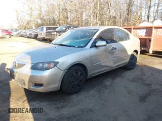 2007 Mazda 3 i Sport with VIN JM1BK32F271735119, listed as a IAAI auction lot 41446801 with 116,879 mi miles. Bid and sale history available at carsss.com. Image 2.