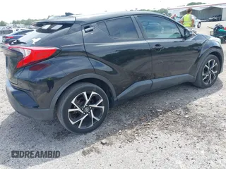 2018 Toyota C-HR XLE with VIN NMTKHMBX0JR008423, listed as a IAAI auction lot 42091445 with 124,811 mi miles. Bid and sale history available at carsss.com. Image 4.