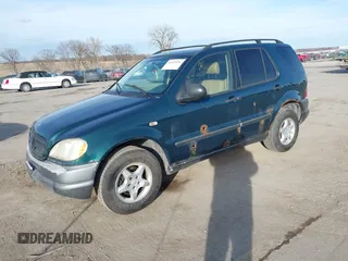 1998 Mercedes-Benz M-Class with VIN 4JGAB54E7WA034632, listed as a IAAI auction lot 41523291 with 153,241 mi miles. Bid and sale history available at carsss.com. Image 2.
