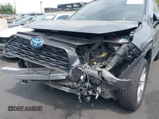 2020 Toyota RAV4 Hybrid XLE with VIN 2T3RWRFV5LW058103, listed as a IAAI auction lot 42665299 with 112,634 mi miles and . Bid and sale history available at DreamBid. Image 6.