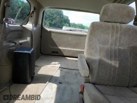 2000 Toyota Sienna LE z VIN 4T3ZF13C7YU259075, wystawiony jako Copart lot #58416105 z przebiegiem 235 788 mil mil oraz Szkoda całkowita • Salvage title. Historia ofert i sprzedaży dostępna na DreamBid. Obrazek 10.
