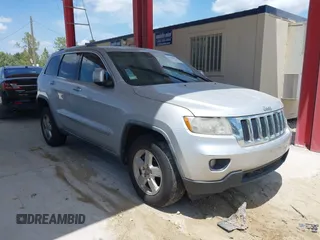 2011 Jeep Grand Cherokee Laredo with VIN 1J4RR4GG3BC540655, listed as a IAAI auction lot 42158522 with 214,341 mi miles and . Bid and sale history available at DreamBid. Image 1.