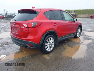 2015 Mazda CX-5 Grand Touring with VIN JM3KE4DY6F0501072, listed as a IAAI auction lot 41534176 with 90,160 mi miles. Bid and sale history available at carsss.com. Image 4.