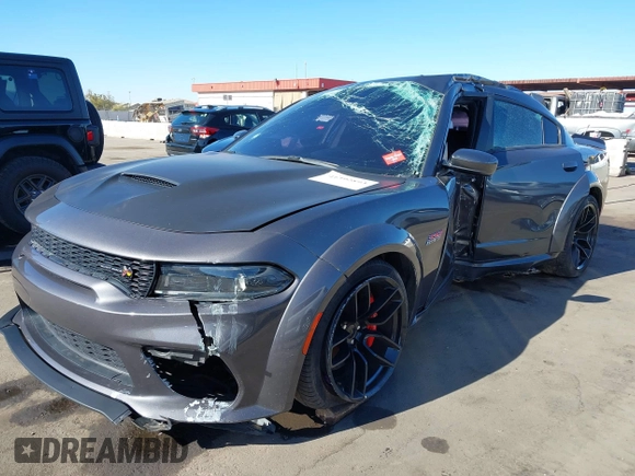 2022 Dodge Charger Scat Pack Widebody with VIN 2C3CDXGJ1NH204130, listed as a IAAI auction lot 41392893 with 9,515 mi miles and . Bid and sale history available at DreamBid. Image 17.