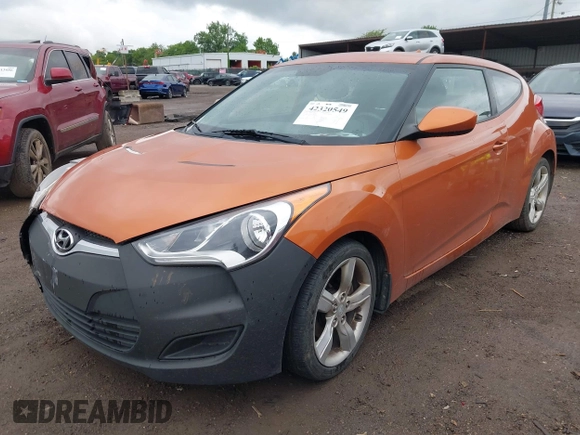 2012 Hyundai Veloster w/Gray Int with VIN KMHTC6AD3CU057620, listed as a IAAI auction lot 42320549 with 113,491 mi miles and . Bid and sale history available at DreamBid. Image 2.