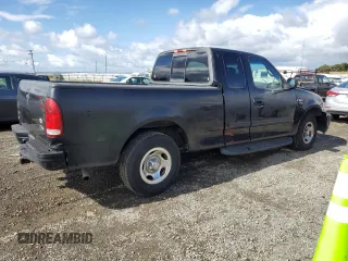 2001 Ford F-150 XL with VIN 1FTRX17W91NB71630, listed as a Copart auction lot 56583545 with 209,009 mi miles and Salvage title. Bid and sale history available at DreamBid. Image 3.