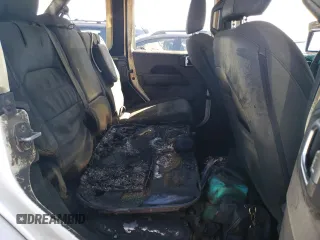 2023 Jeep Wrangler Sahara z VIN 1C4JJXP61PW519599, wystawiony jako Copart lot #51814674 z przebiegiem Nie podano mil oraz Szkoda całkowita • Salvage title. Historia ofert i sprzedaży dostępna na DreamBid. Obrazek 10.