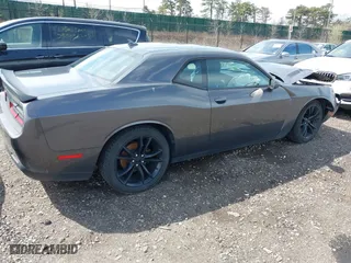 2016 Dodge Challenger SXT Plus with VIN 2C3CDZAG5GH323195, listed as a IAAI auction lot 42019175 with 79,968 mi miles. Bid and sale history available at carsss.com. Image 4.