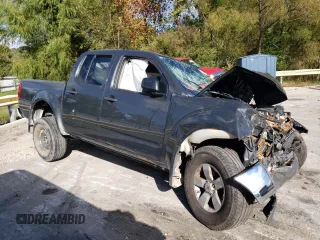2010 Nissan Frontier Pro-4X with VIN 1N6AD0EVXAC414638, listed as a Copart auction lot 72902794 with Not provided miles and Salvage title. Bid and sale history available at DreamBid. Image 4.