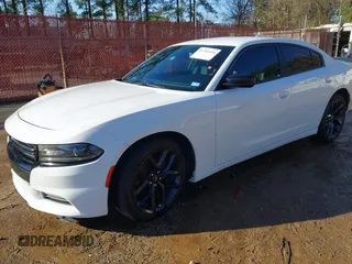 2020 Dodge Charger SXT with VIN 2C3CDXBG1LH150482, listed as a IAAI auction lot 41762444 with 97,689 mi miles and . Bid and sale history available at DreamBid. Image 2.