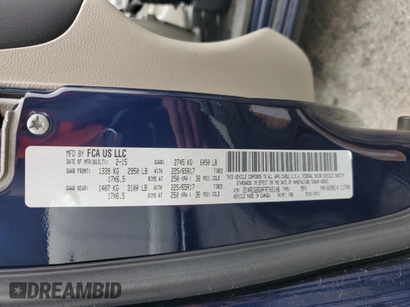 2015 Dodge Grand Caravan SE with VIN 2C4RDGBG0FR702106, listed as a Copart auction lot 54595205 with 209,319 mi miles and Salvage Title. Bid and sale history available at DreamBid. Image 13.