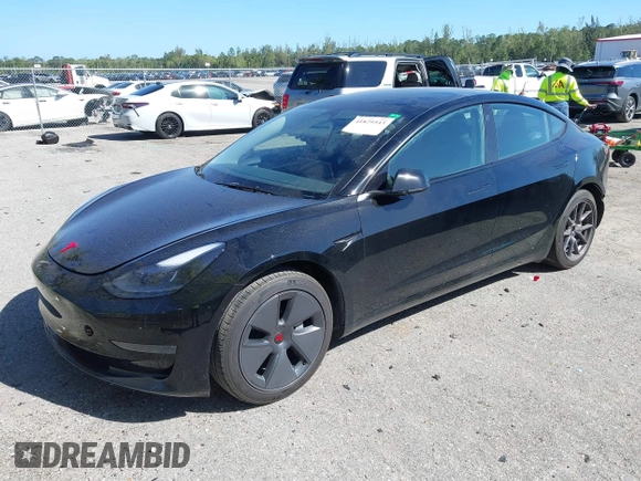 2023 Tesla Model 3 with VIN 5YJ3E1EAXPF623403, listed as a IAAI auction lot 41829543 with 29,414 mi miles and . Bid and sale history available at carsss.com. Image 18.
