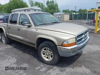 2004 Dodge Dakota SLT with VIN 1D7HG48N54S720724, listed as a IAAI auction lot 42740246 with 153,504 mi miles and . Bid and sale history available at DreamBid. Image 1.