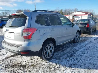 2016 Subaru Forester Touring z VIN JF2SJAXC4GH536085, wystawiony jako IAAI lot #41838081 z przebiegiem 155 930 mil mil oraz . Historia ofert i sprzedaży dostępna na DreamBid. Obrazek 4.