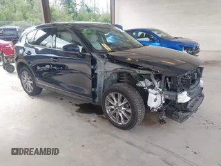 2019 Mazda CX-5 Grand Touring with VIN JM3KFBDM6K0522903, listed as a IAAI auction lot 42583005 with 61,174 mi miles and . Bid and sale history available at DreamBid. Image 1.