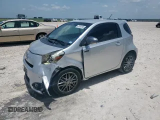 2013 Scion iQ with VIN JTNJJXB04DJ023154, listed as a Copart auction lot 62958165 with 114,135 mi miles and Salvage title. Bid and sale history available at DreamBid. Image 1.