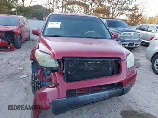 2006 Honda Pilot EX-L with VIN 5FNYF28586B005602, listed as a IAAI auction lot 41247326 with 221,698 mi miles and . Bid and sale history available at DreamBid. Image 12.