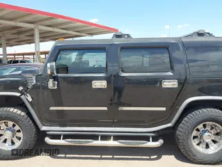 2003 Hummer H2 with VIN 5GRGN23U73H122756, listed as a IAAI auction lot 42194176 with 239,411 mi miles. Bid and sale history available at carsss.com. Image 14.