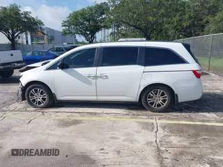 2012 Honda Odyssey EX-L z VIN 5FNRL5H61CB032353, wystawiony jako IAAI lot #42471691 z przebiegiem 186 257 mil mil oraz . Historia ofert i sprzedaży dostępna na DreamBid. Obrazek 14.