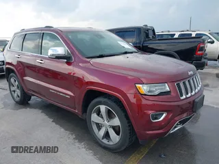 2016 Jeep Grand Cherokee Overland z VIN 1C4RJECG5GC472956, wystawiony jako IAAI lot #42139911 z przebiegiem 94 477 mil mil oraz . Historia ofert i sprzedaży dostępna na DreamBid. Obrazek 1.