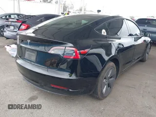 2023 Tesla Model 3 with VIN 5YJ3E1EA7PF473749, listed as a IAAI auction lot 41921478 with 21,483 mi miles and . Bid and sale history available at DreamBid. Image 4.