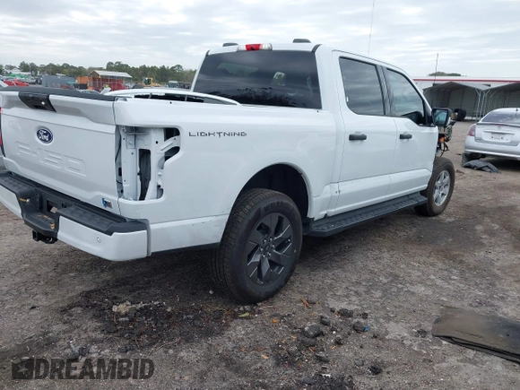 2024 Ford F-150 Lightning XLT with VIN 1FTVW3LKXRWG01185, listed as a IAAI auction lot 41679606 with 4,961 mi miles and . Bid and sale history available at DreamBid. Image 4.