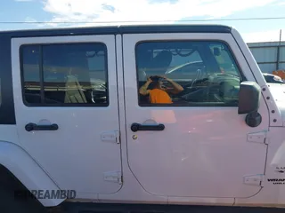 2017 Jeep Wrangler Unlimited Sahara with VIN 1C4BJWEG2HL552382, listed as a IAAI auction lot 41631092 with 96,097 mi miles and . Bid and sale history available at DreamBid. Image 14.