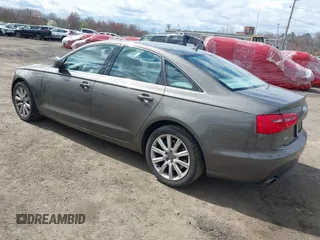 2013 Audi A6 Premium Plus z VIN WAUGGAFC1DN038375, wystawiony jako IAAI lot #42051929 z przebiegiem 118 181 mil mil oraz . Historia ofert i sprzedaży dostępna na DreamBid. Obrazek 3.
