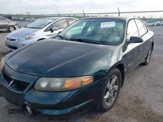 2002 Pontiac Bonneville SLE z VIN 1G2HY54K324126583, wystawiony jako IAAI lot #41939075 z przebiegiem 178 591 mil mil oraz . Historia ofert i sprzedaży dostępna na DreamBid. Obrazek 2.