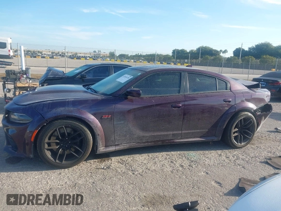 2021 Dodge Charger Scat Pack Widebody with VIN 2C3CDXGJXMH559036, listed as a IAAI auction lot 41895328 with 55,017 mi miles and . Bid and sale history available at DreamBid. Image 14.