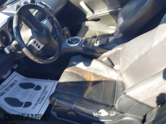 2003 Nissan 350Z Touring z VIN JN1AZ34E73T014727, wystawiony jako IAAI lot #41377420 z przebiegiem 170 323 mil mil oraz . Historia ofert i sprzedaży dostępna na DreamBid. Obrazek 5.