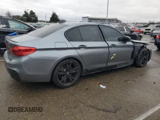2018 BMW 5 Series M550i xDrive with VIN WBAJB9C54JB286707, listed as a Copart auction lot 49158435 with 74,307 mi miles and Salvage title. Bid and sale history available at DreamBid. Image 3.