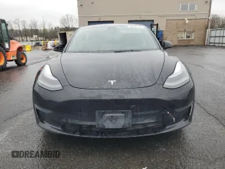 2021 Tesla Model 3 Standard Range Plus with VIN 5YJ3E1EA2MF087879, listed as a Copart auction lot 51853235 with 65,477 mi miles and Non Repairable. Bid and sale history available at carsss.com. Image 5.