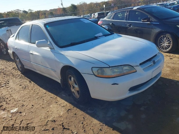 1999 Honda Accord Sdn EX with VIN 1HGCG1656XA055933, listed as a IAAI auction lot 40877831 with 241930 miles. Bid and sale history available at carsss.com. Image 1.